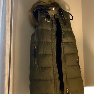 Long green puffer vest with faux fur hood